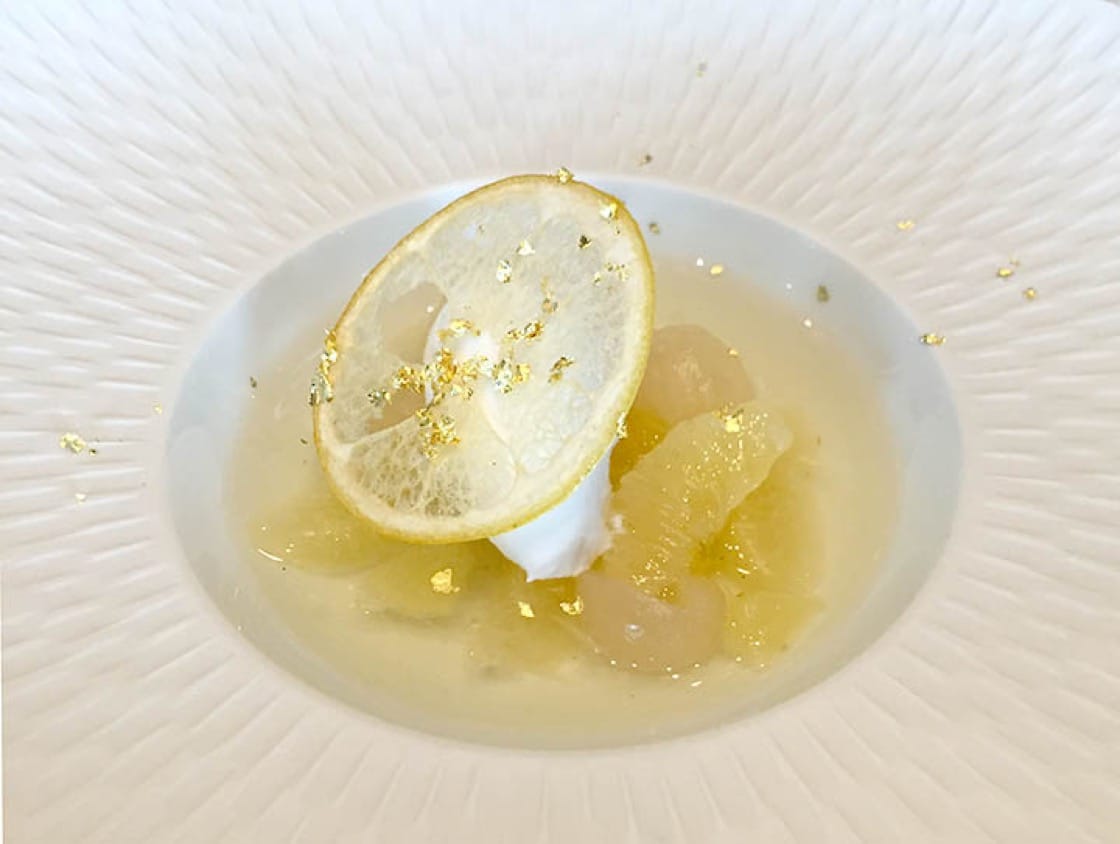 Coconut sorbet with longans topped with a chip of Japanese kotnasu citrus