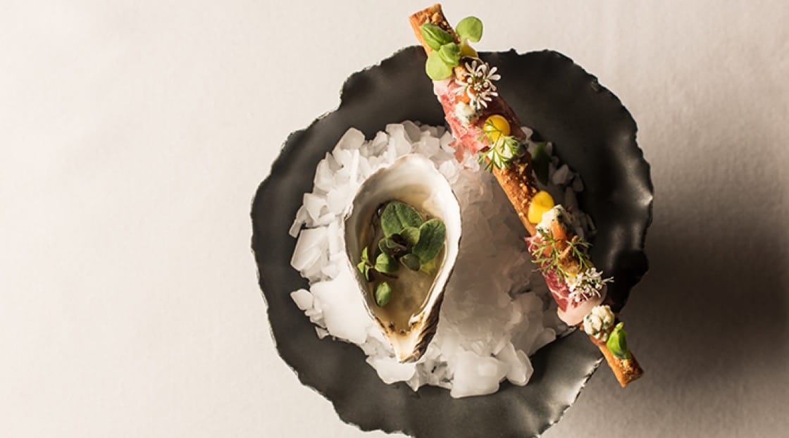 The Beausoleil oyster and jamón Mangalica at Oriole. (Photo courtesy Oriole.)