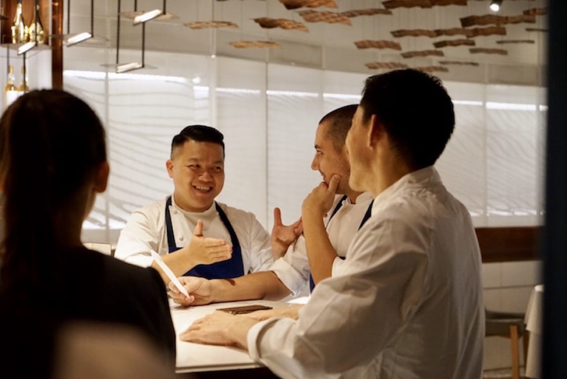 (From left) Kai Ho, Julien Royer and Hideaki Sato in the pre-dinner briefing session, in preparation for the night’s six-hands dinner. (Photo by Liz Kao)