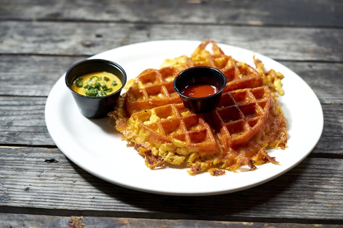 Creamy mac-n-cheese gets pressed into a waffle at Arrogant Swine. (Photo courtesy of Chris Gampat/Arrogant Swine.)