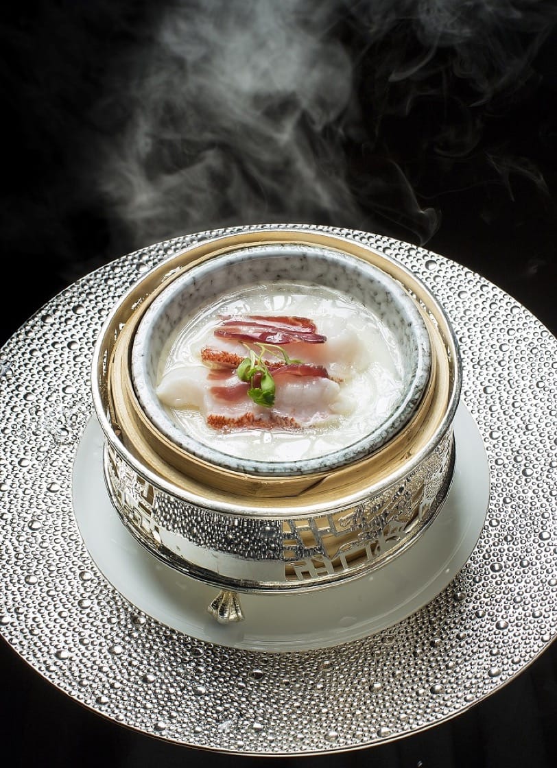 Chef Tam's steamed sliced garoupa with egg white custard and aged 'Huadiao' wine will be featured on the 4-hands menu. (Photo credit: City of Dreams)