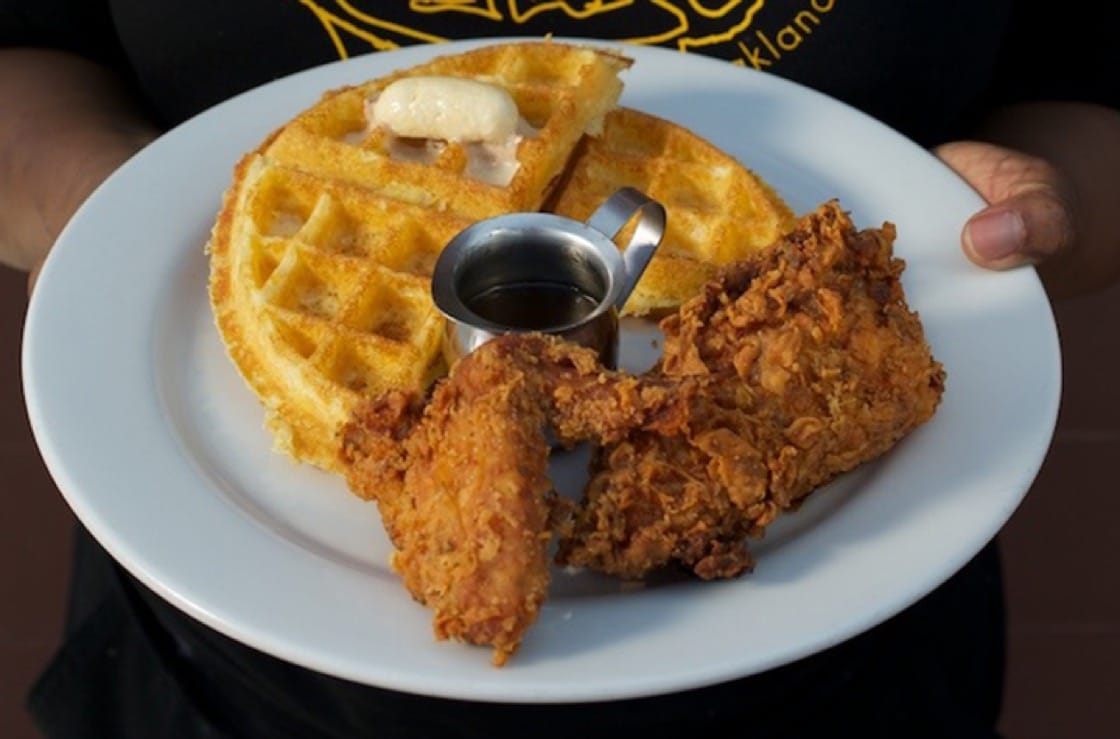 Buttermilk fried chicken with a cornmeal waffle and apple cider syrup.