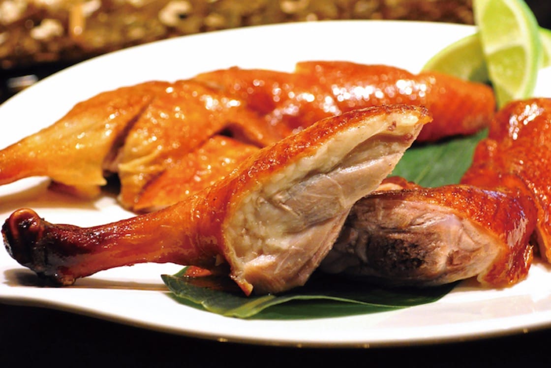 A signature dish of roast duck at Le Palais.