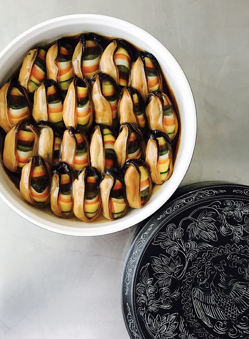 Mussels stuffed with glass noodles and fine vegetables. (Photo courtesy of Benu.)