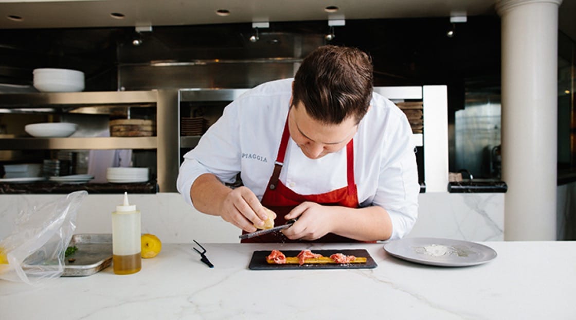 Flamm plating the grissini carpaccio dish. (Photo by Matt Haas.)