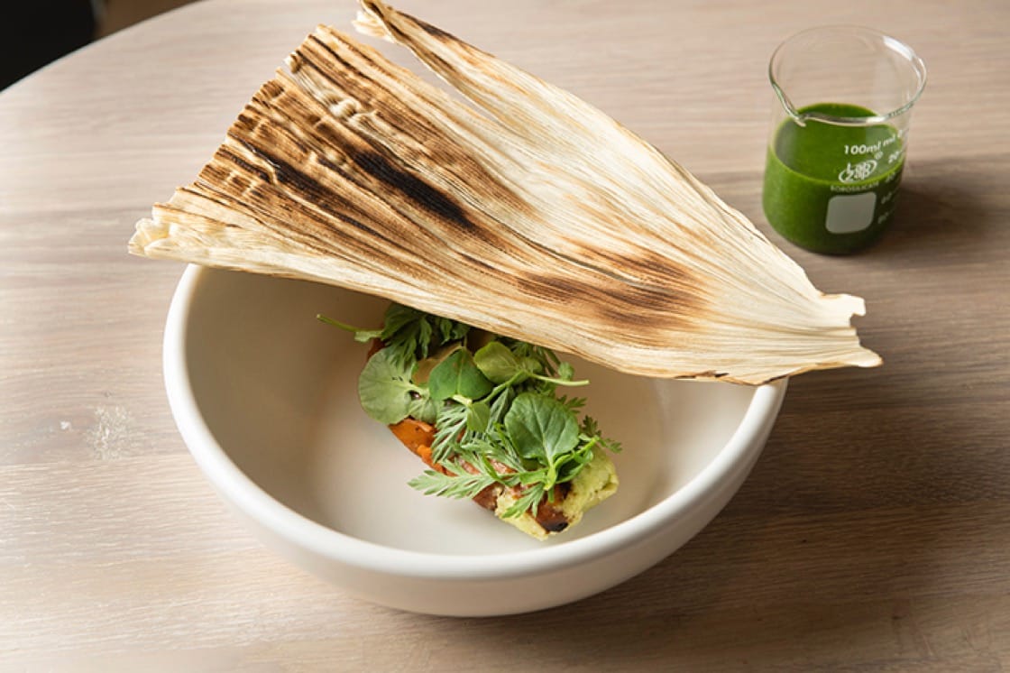 Charred carrot tamal with green garlic and 'hoja santa' mole at Oxomoco in Brooklyn. (Photo by Evan Sung.) 