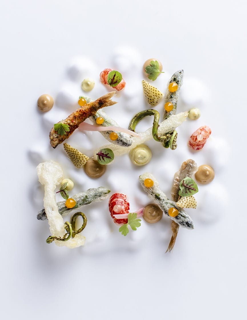 Spring on a plate: asparagus, smelt, crawfish, and spring onions, fiddlehead ferns and green strawberries from Fresh Run Farm. (Photo by Kelly Puleio.)