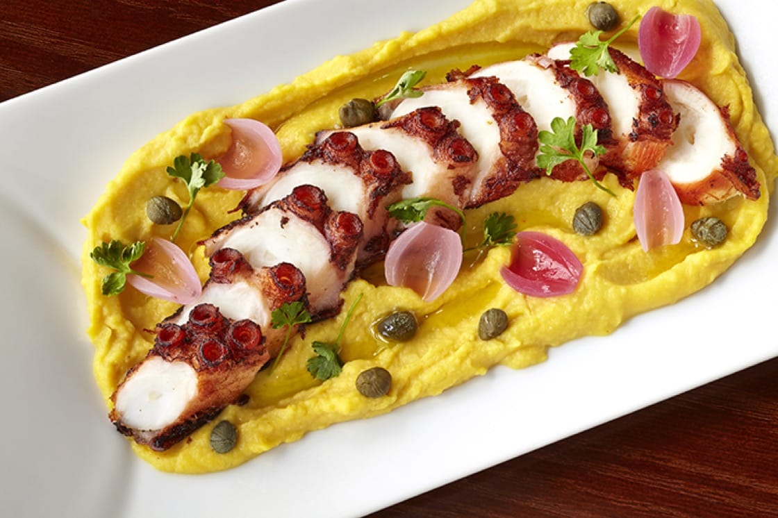 Octopus Santorini at Zaytinya, featuring grilled Mediterranean octopus, marinated onions, capers and yellow split pea puree. (Photo courtesy of Think Food Group.)