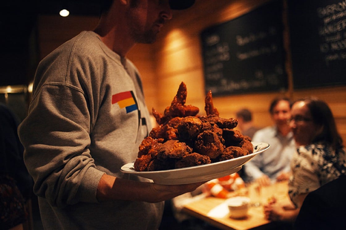 Fried chicken piled high at Momofuku Noodle Bar. (Photo by Gabriele Stabile.) 