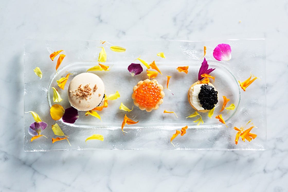 The caviar cookie trio at Siren by RW is a play on the "black & white," macarón and linzer cookies. (Photo by Scott Suchman.)