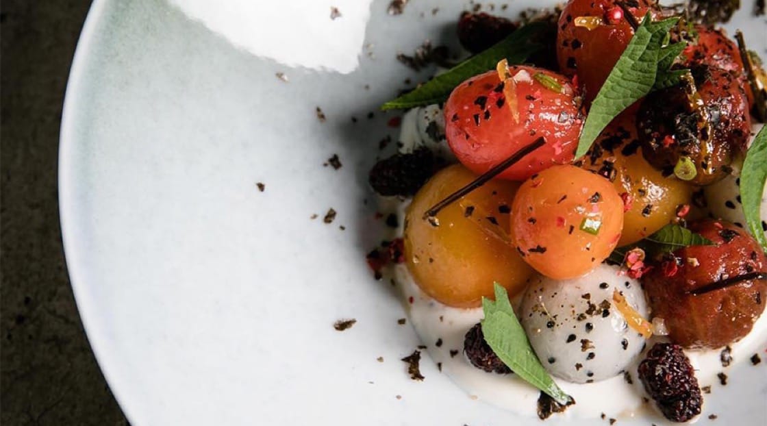 Chiang Mai Tomato Salad, served with Mulberries, candied Yuzu, dragon fruit and a house made almond ricotta. Photo Credit: Bunker.