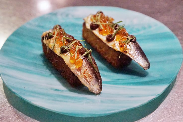 Mendes prefers to buy fresh sardines and cure them himself in a simple mix of olive oil and Sherry vinegar. (Photo courtesy of Aldea.)
