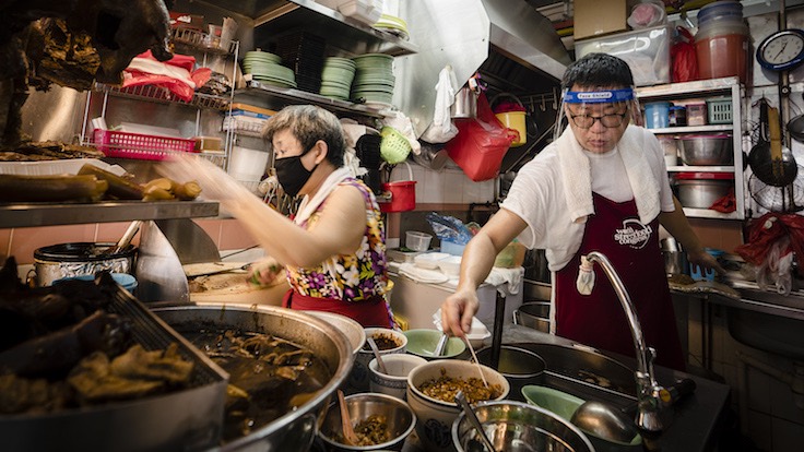 Melvin Chew and his mother at their stall (Photo & thumbnail photo: John Heng)