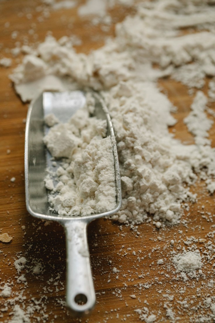 canva-scoop-with-flour-on-table-in-kitchen-MAERUznU8Ac.jpg