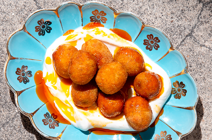 Balaboosta's fried olives with harissa oil. Photo courtesy of Balaboosta