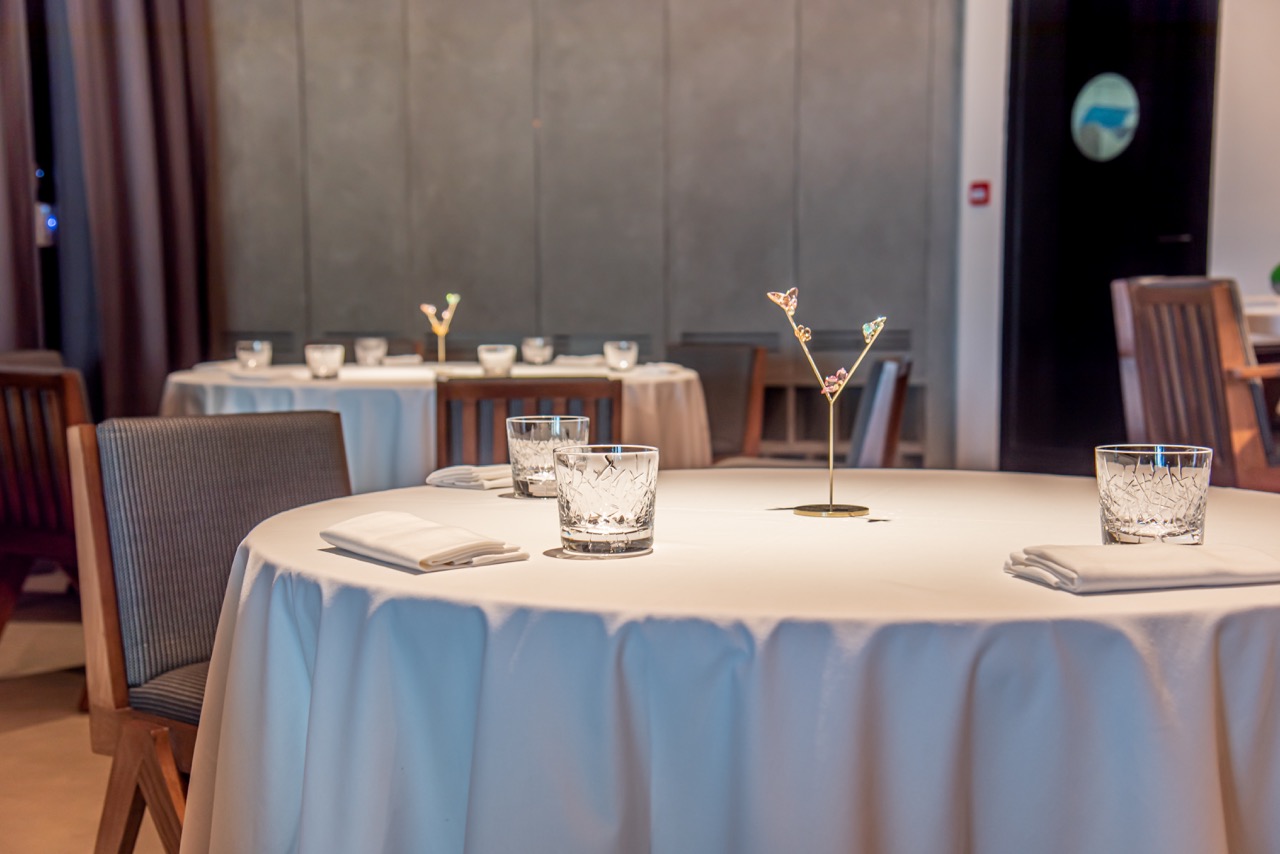 A theatrical 18-course dining experience takes place in a simple, yet elegant setting. Image credit: Trèsind Studio