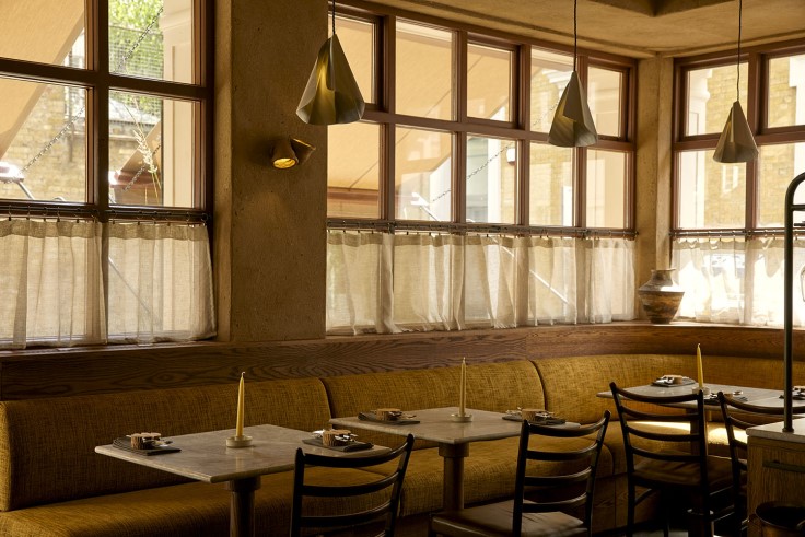 The earthy, natural hues of the room are the perfect complement for Kirk Haworth's cooking at Plates London. © Safia Shakarchi