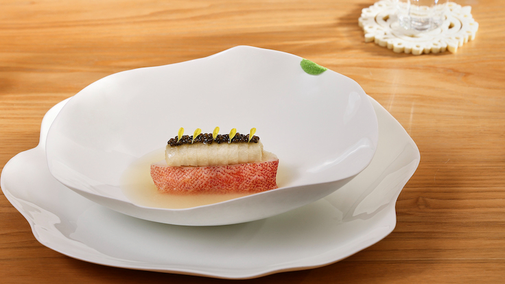 At JL Studio, Lim reimagines chicken rice with poached fish and porridge-like rice.