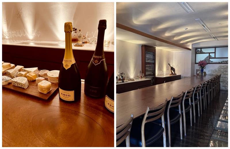 Magnum champagne, assorted cheeses, and a calm bar setting. © Cave de K