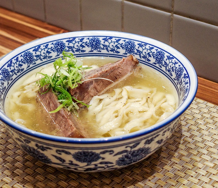 The Japanese chef at MICHELIN-selected restaurant Kou Gyu Rou draws on his ramen experience and cultural roots and creates a unique bowl of beef noodle soup. (©MICHELIN)