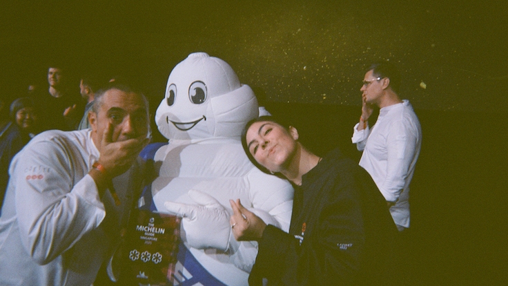 Chef Julien Royer and Ines Carriere Bega striking a pose with Bibendum. (Photo by David Thiry-Baetens of 3-Star Odette)