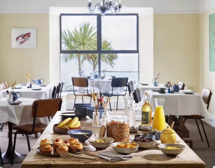 Outlaw's Guest House's breakfast spread and sea view. © Outlaw's Guest House