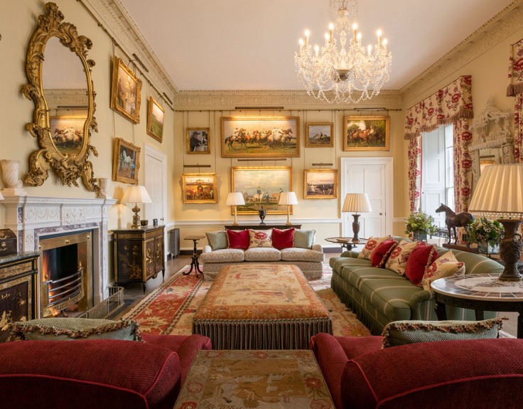 A grand salon at Cashel Palace, filled with horse-themed artworks. © Cashel Palace