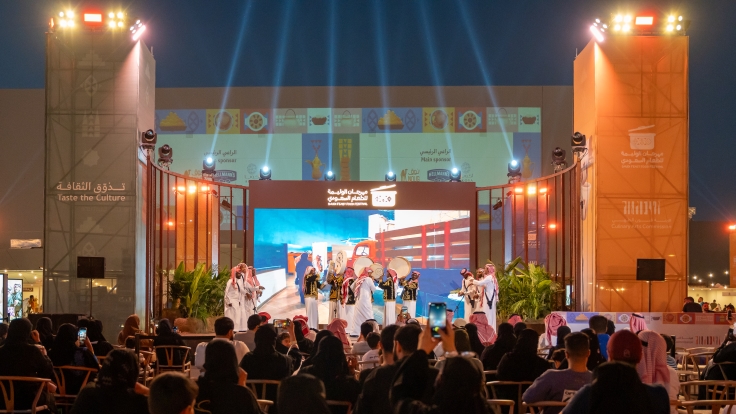 A traditional Saudi dance is performed on stage at the Saudi Feast Food Festival. ©Culinary Arts Commission - Ministry of Culture Saudi Arabia