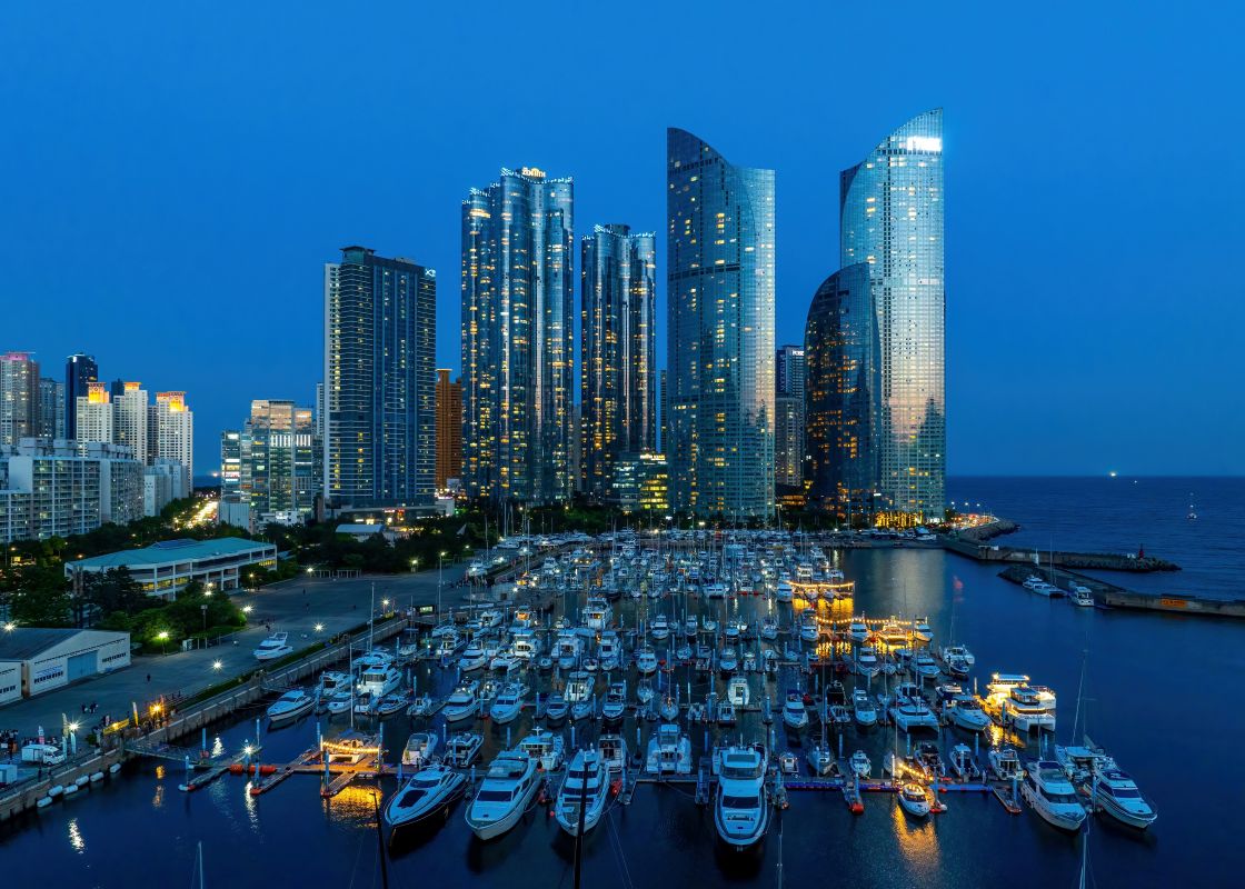 Marine City’s skyline rising above the yacht harbor at dusk.