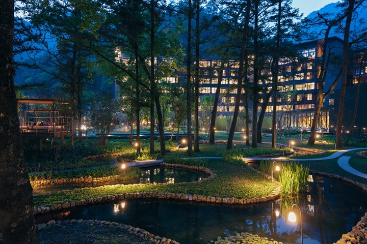 Artificial stream that flows through the main building, restaurant and reading lounge, forming a "water garden." at Hoshinoya Guguan.