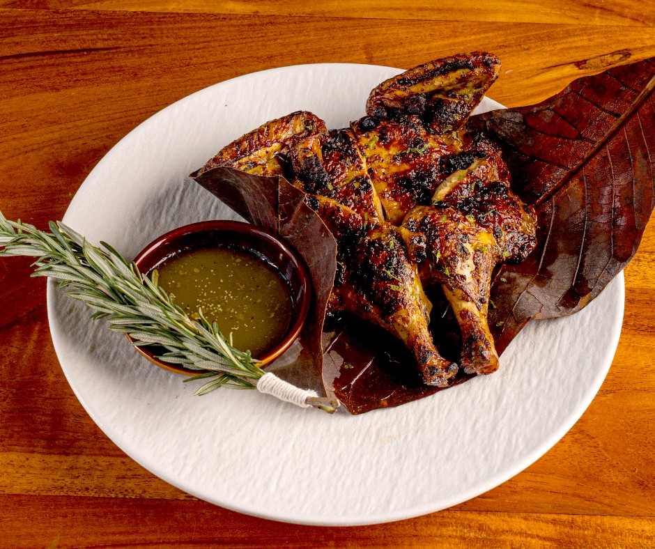 Corn-fed baby chicken with a slight char is deboned and served with a ponzu-shiso butter. Image credit:  Seif El-Beheery/3Fils Abu Dhabi