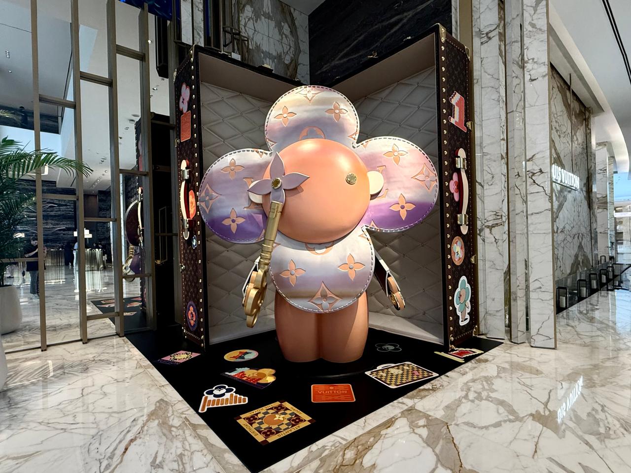 Louis Vuitton's iconic flower head mascot playfully stands tall in the corner of the hotel's lobby. Image credit: Kelly Sadek