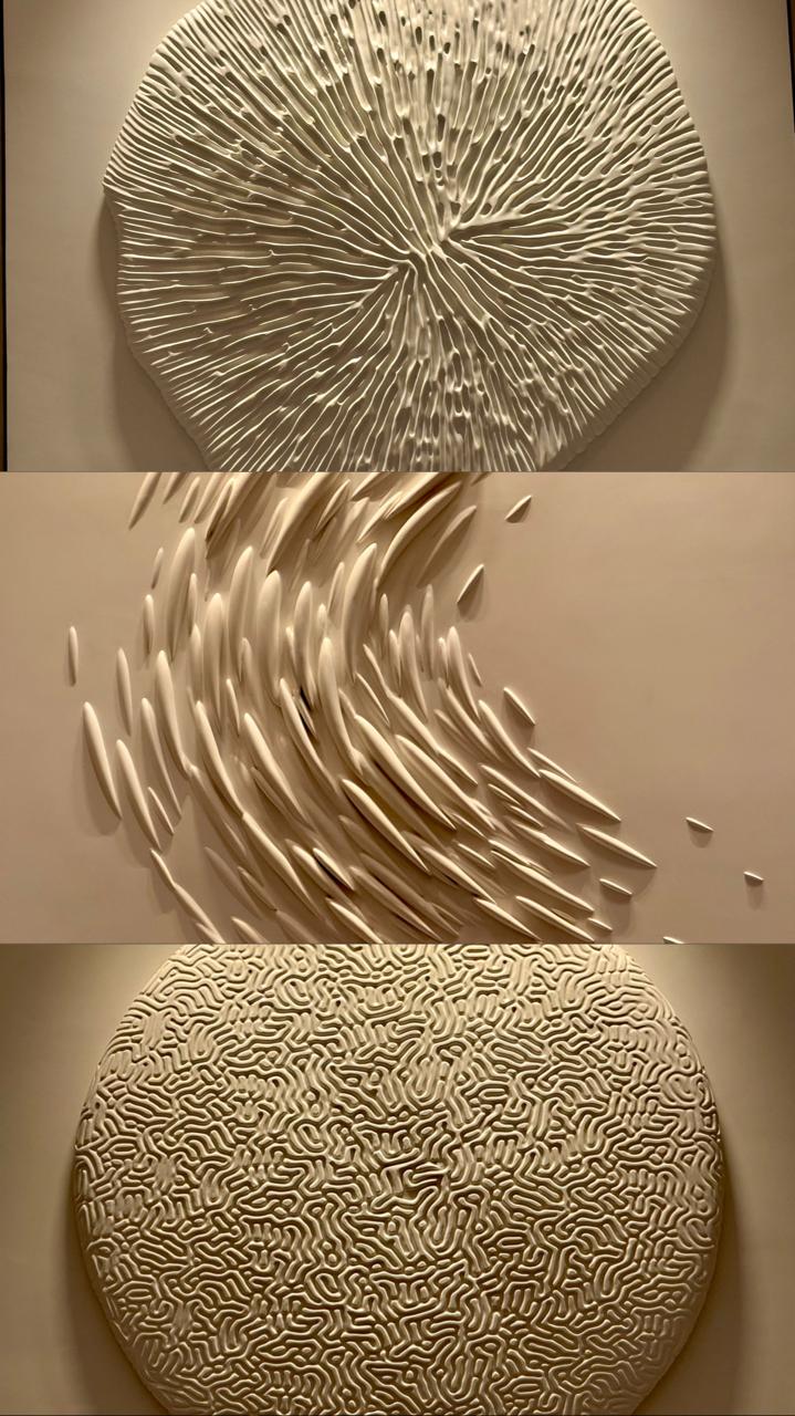 Each elevator lobby leading up to the rooms has a wall adorned with a sculpture alluding to the sea. Image credit: Kelly Sadek