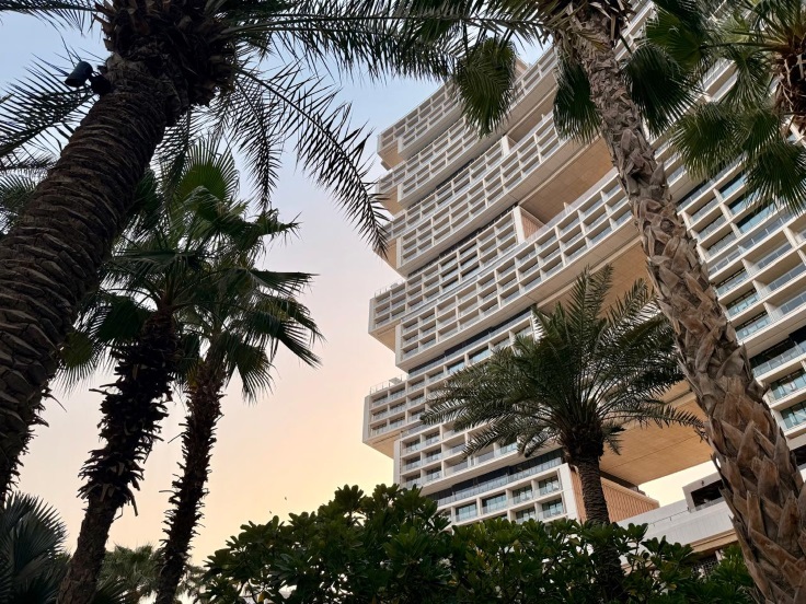 The sunset colors the skies around the hotel's facade. Image credit: Kelly Sadek