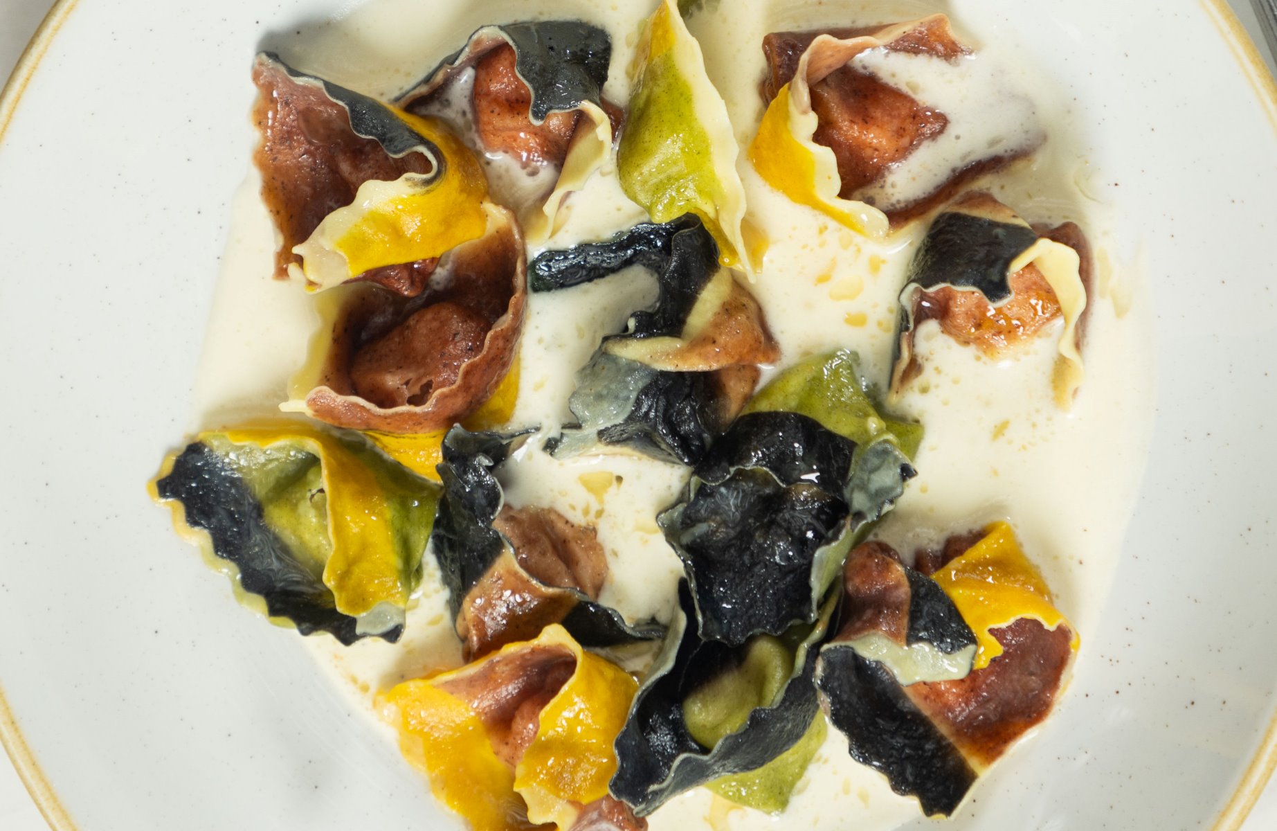 Tortelli stuffed with prosciutto and ricotta cheese, served with cream, butter, and Parmesan cheese, at Vinheria Percussi. © Ricardo D'Angelo/Vinheria Percussi