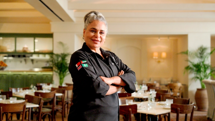 Bahraini chef Roaya Saleh proudly stands in her Riyadh branch of Villa Mamas. © Michelin