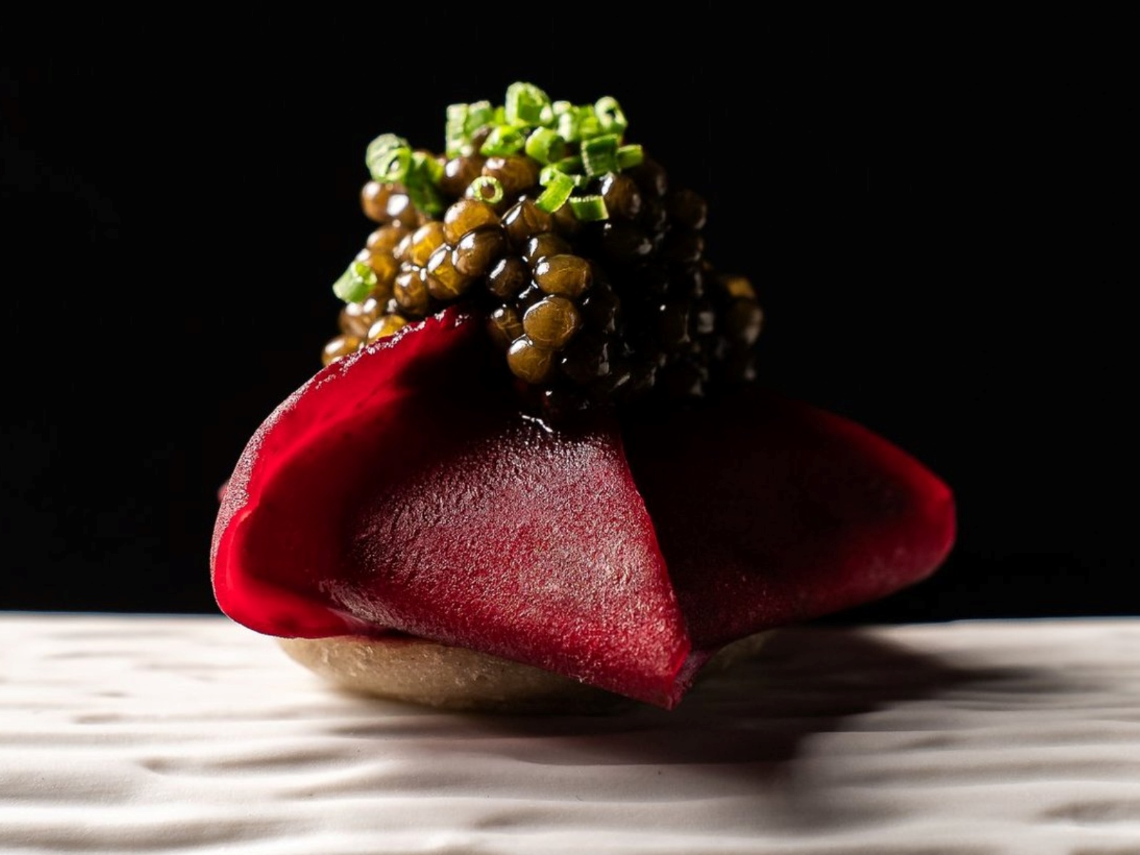 Beetroot flower with smoked eel and caviar – one of the dishes served at the laid-back Mont Bar, which now has Two MICHELIN Stars in Barcelona. © Mont Bar