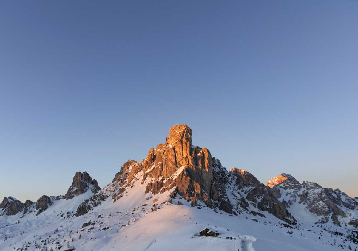 In the Dolomites, the mountain peaks glow a multitude of shades of pink and oranges at sunset. © Arianna Mazzer