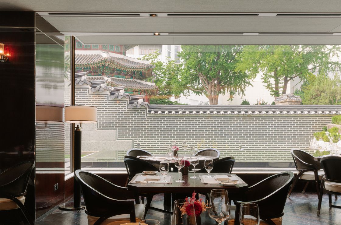 From The Ninth Gate, an American-style restaurant at The Westin Josun Seoul, guests look out toward the walled garden surrounding the historic Hwanggungu Pavilion. ©The Westin Josun Seoul