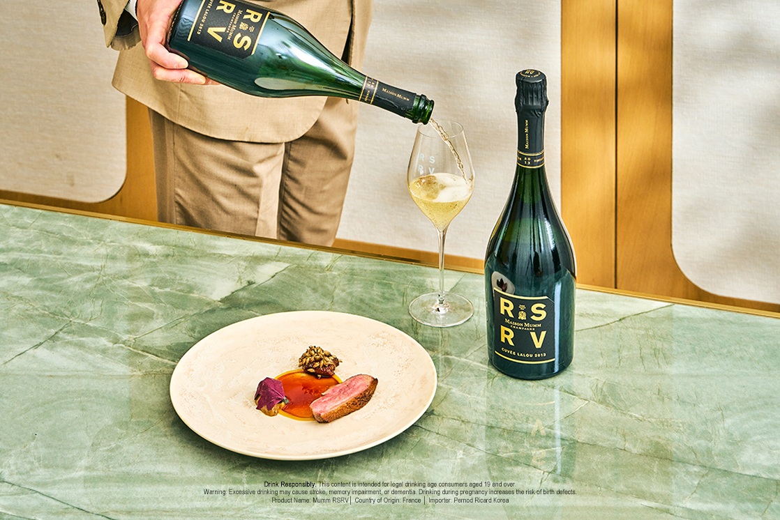 RSRV Lalou 2013 elevates the duck’s deep flavors — where the land’s character and terroir-driven Champagne meet in the glass. ©The MICHELIN Guide