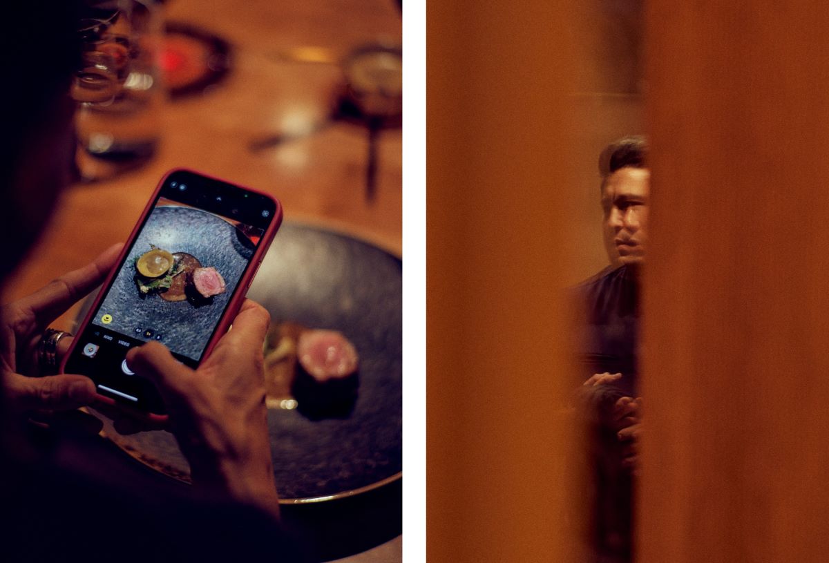 The main course — Poltinger lamb with artichoke, fig and Macvin — being photographed by a guest for Instagram, plus Chef Tohru Nakamura. © Wim Jansen/The MICHELIN Guide