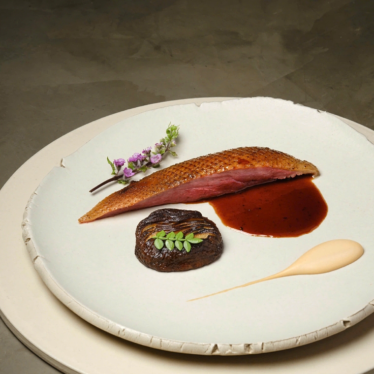 The chef proudly served Mallard duck, a Northern Vietnamese breed, followed by French pigeon — a bold back-to-back contrast. (© Koi Nguyen/CieL)