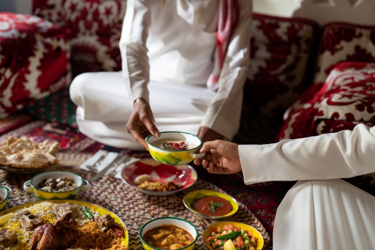 Diners enjoy a traditional Saudi feast together on the floor at Najd Village. © Homere Semaan/MICHELIN Guide