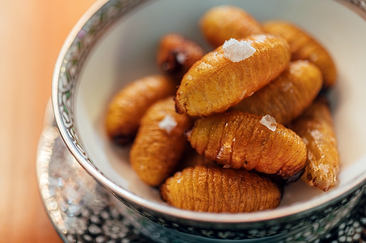 Dare you try cooked sago beetle larvae? (© Anuwat Senivansa Na Ayudhya/The MICHELIN Guide Thailand)