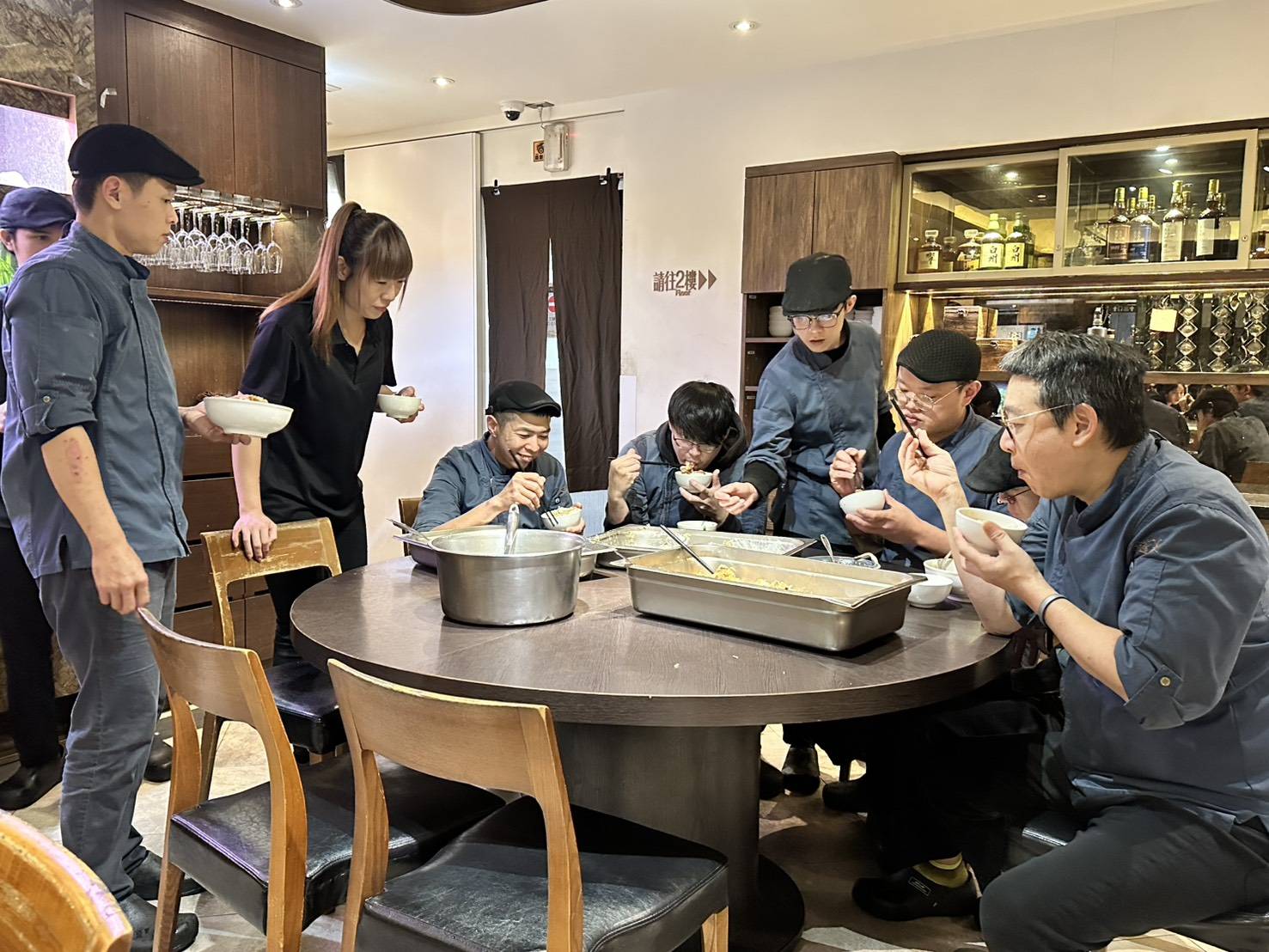 Sharing a meal together is a tradition at Golden Formosa, passed down from Chef Eric Chen’s grandfather. Chen is pictured on the far left. © Golden Formosa