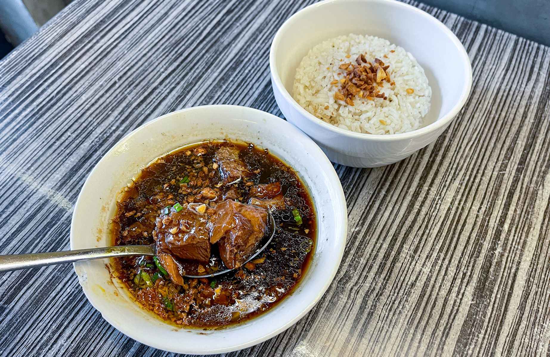 Beef pares, a Cebu favorite, features tender braised beef in a savory sauce, typically served with rice. ©  Pares Pares (N. Escario Street) 