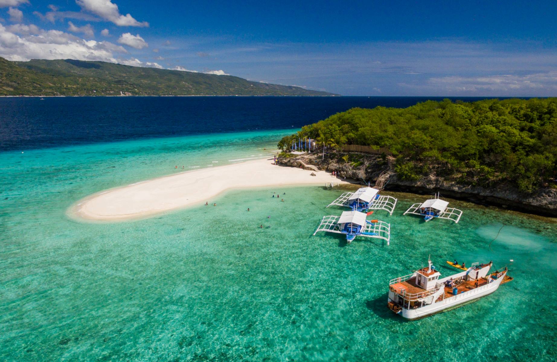 Cebu, an island city embraced by turquoise waters, is known as much for its vibrant streets as for its rich, flavorful cuisine. © KrisCav/iStock