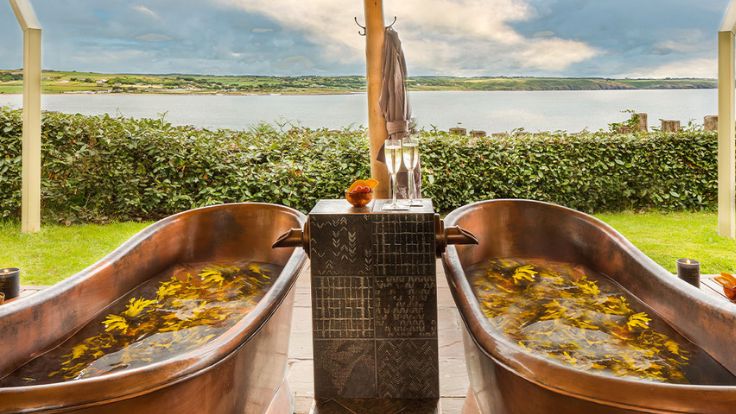 Take to the hotel's relaxation terrace for a bath with a view over Ardmore Bay (© Cliff House Hotel)