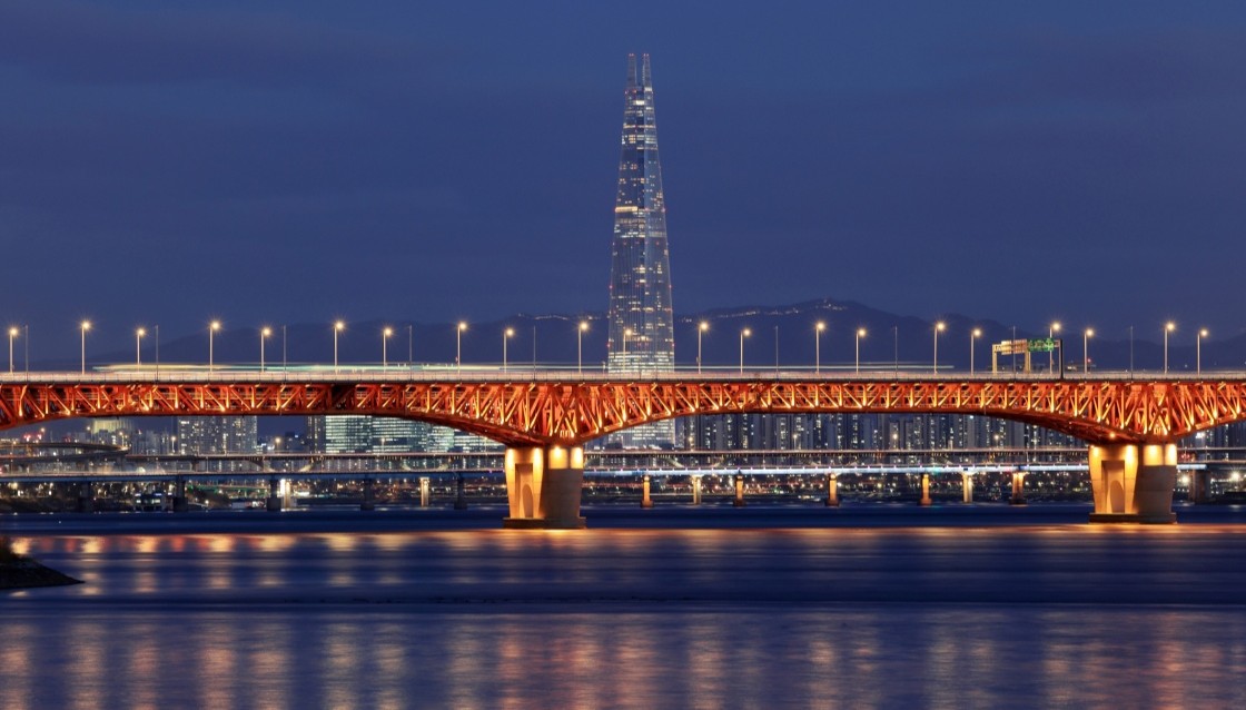 A nighttime view across Seongsu Bridge, where the Han River meets Seoul’s industrial edge and modern skyline. © Stock for You