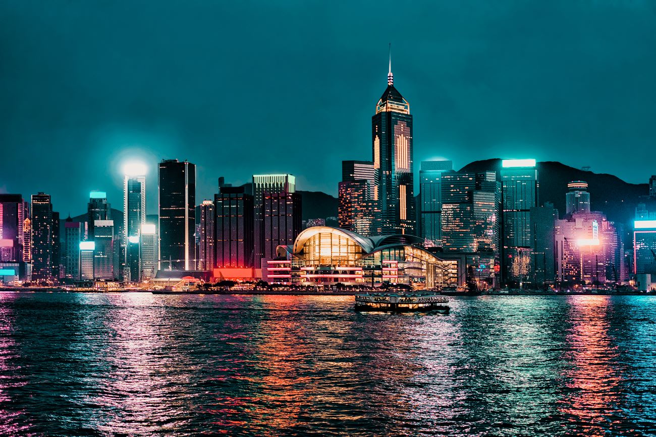 The view of Hong Kong’s Port of Victoria across the water at night. © RomanBabakin/iStock